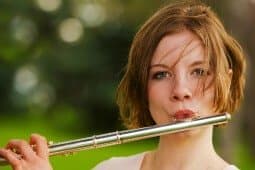 A woman playing the flute.